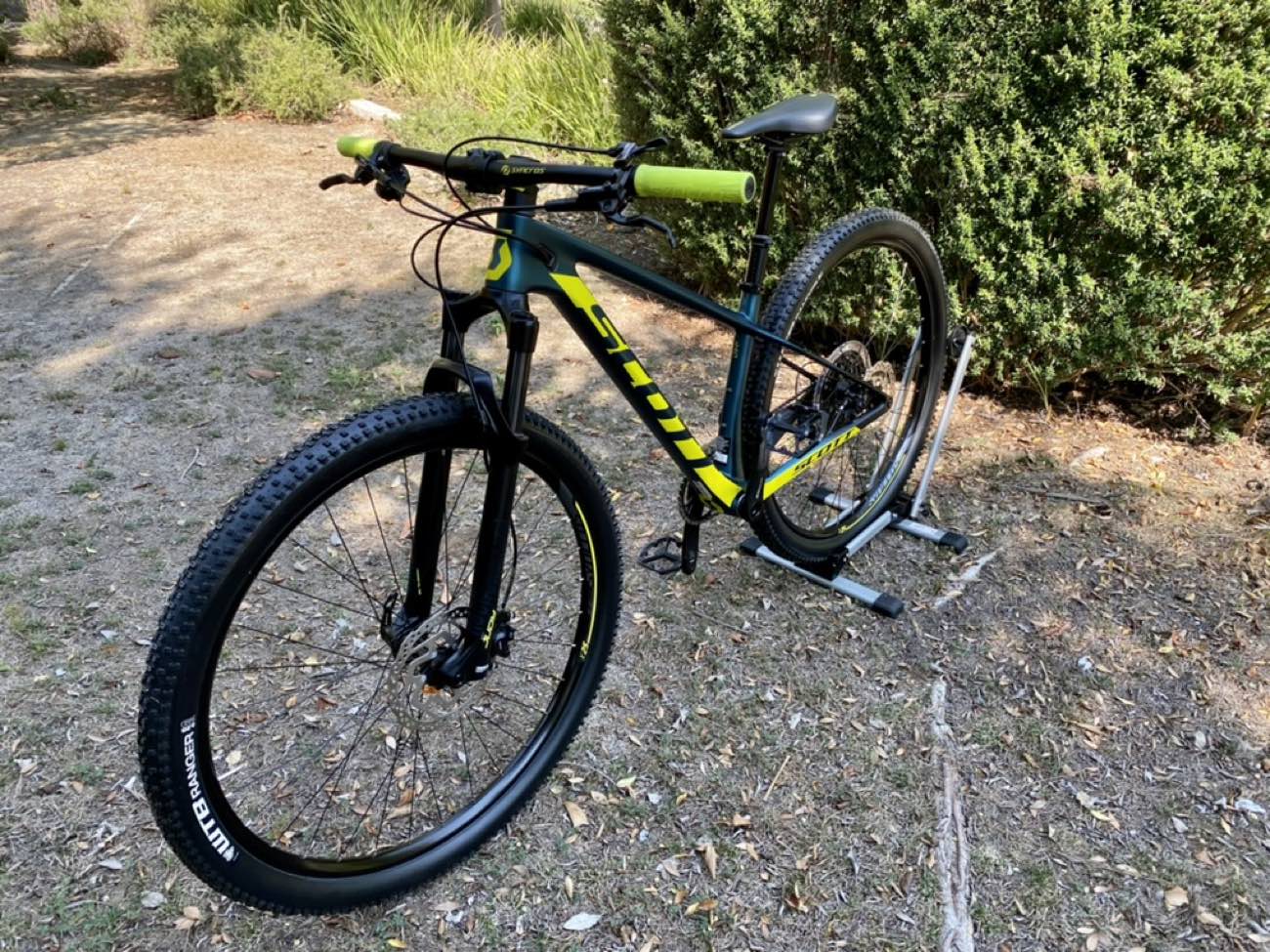 Entry-level Scott hardtail mountain bike parked on a dirt clearing